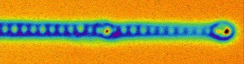 Atomic force microscopy image of the end of a mono-atomic iron wire. The individual iron atoms are clear to see, as well as the “eye” of the Majorana fermions on the end.